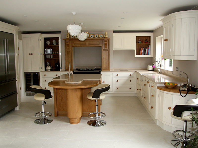 This Kitchen is Contemporary with Traditional Twist. European Oak and painted Farrow & Ball Pointing alongside Creme Stellar Silestone Worktops.