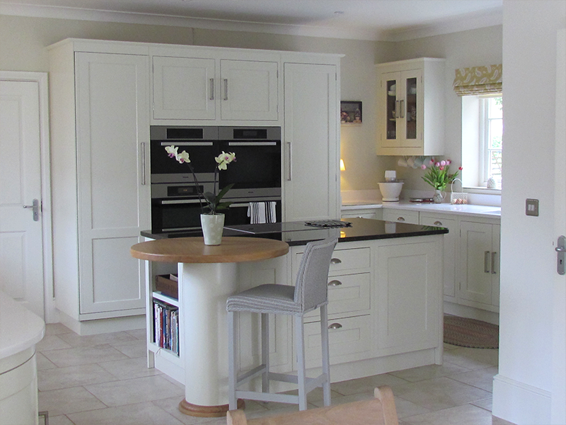 This Simply Elegant hand-made kitchen is absolutely beautiful. White, Oak and black granite worktops. Designed and manufacture in our workshop in Suffolk.