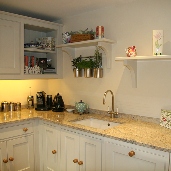 This Charming and Quaint Kitchen is just perfect for the space available. Wooden Handles and island coupled with granite worktops.