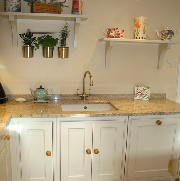 This Charming and Quaint Kitchen is just perfect for the space available. Wooden Handles and island coupled with granite worktops.