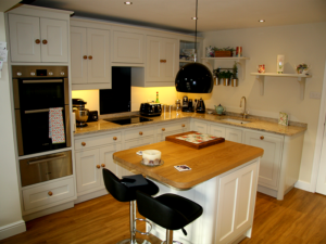 This Charming and Quaint Kitchen is just perfect for the space available. Wooden Handles and island coupled with granite worktops.