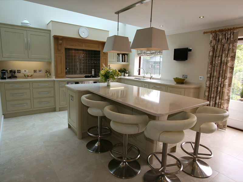 This Sleek & Sophisticated Kitchen designed by Knights Country Kitchens, highlights soft cream and greys, coupled with an italian porcelain floor. Integrated oven, wine cooler and oak worktops to compliment the sleek design. Bespoke Kitchens
