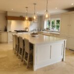 Desired Dream Kitchen an impressive family kitchen with clean lines and oak accents. Design, manufactured and installed by Knights Country Kitchens.