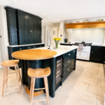 The Beauty of Bespoke Kitchen Details. Take a look at a handcrafted kitchen with integrated chopping boards. Warm Wood Tones Kitchen